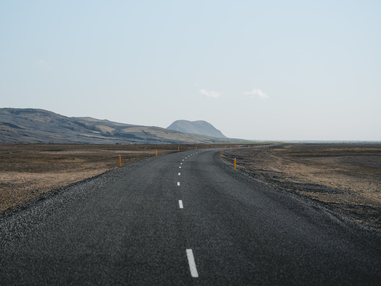 Empty open road stretching to the horizon symbolizing freedom of a career break