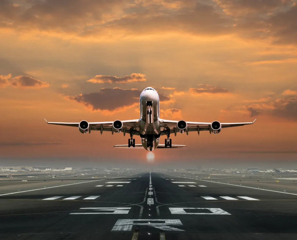 Airplane on runway at sunset — ready for takeoff